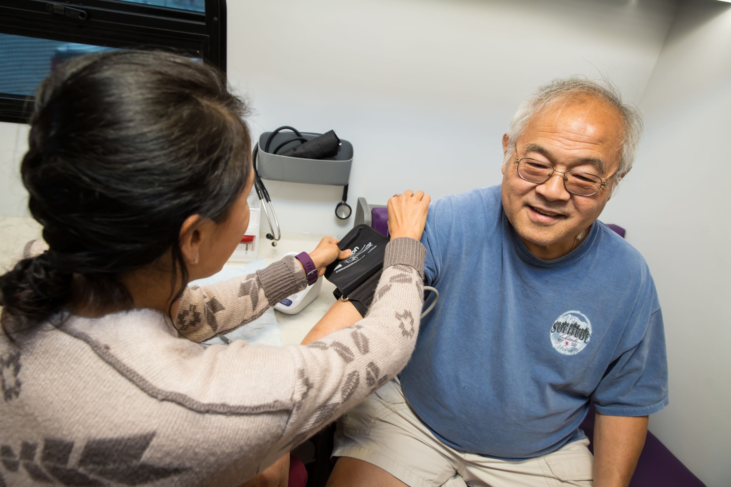 Health coach Monica Salas helps patient Tom Din with type 2 diabetes care.