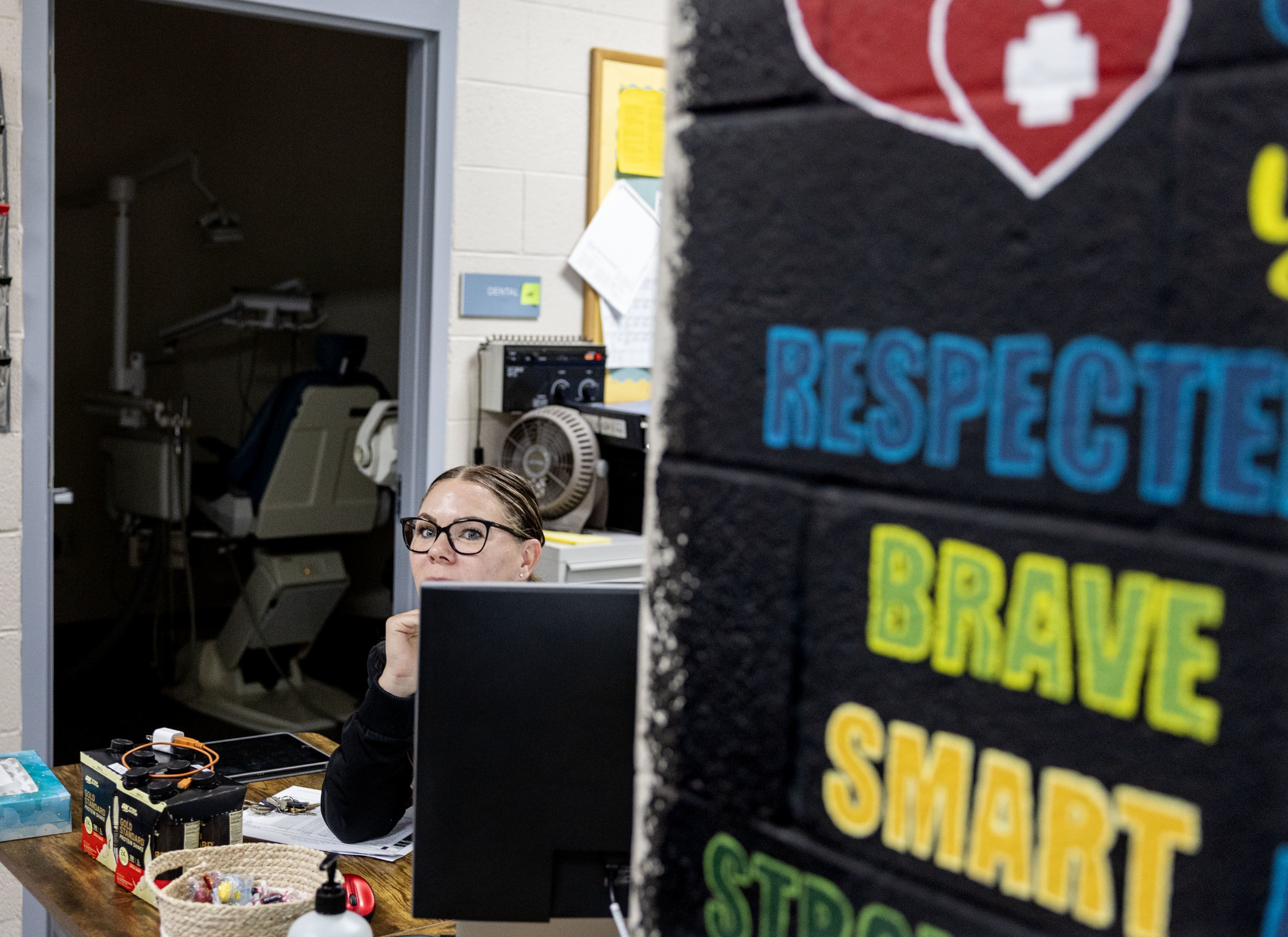 Shannon Osburn, RN, sits at her desk in the nurses' office at Salt Lake Valley Youth Center.