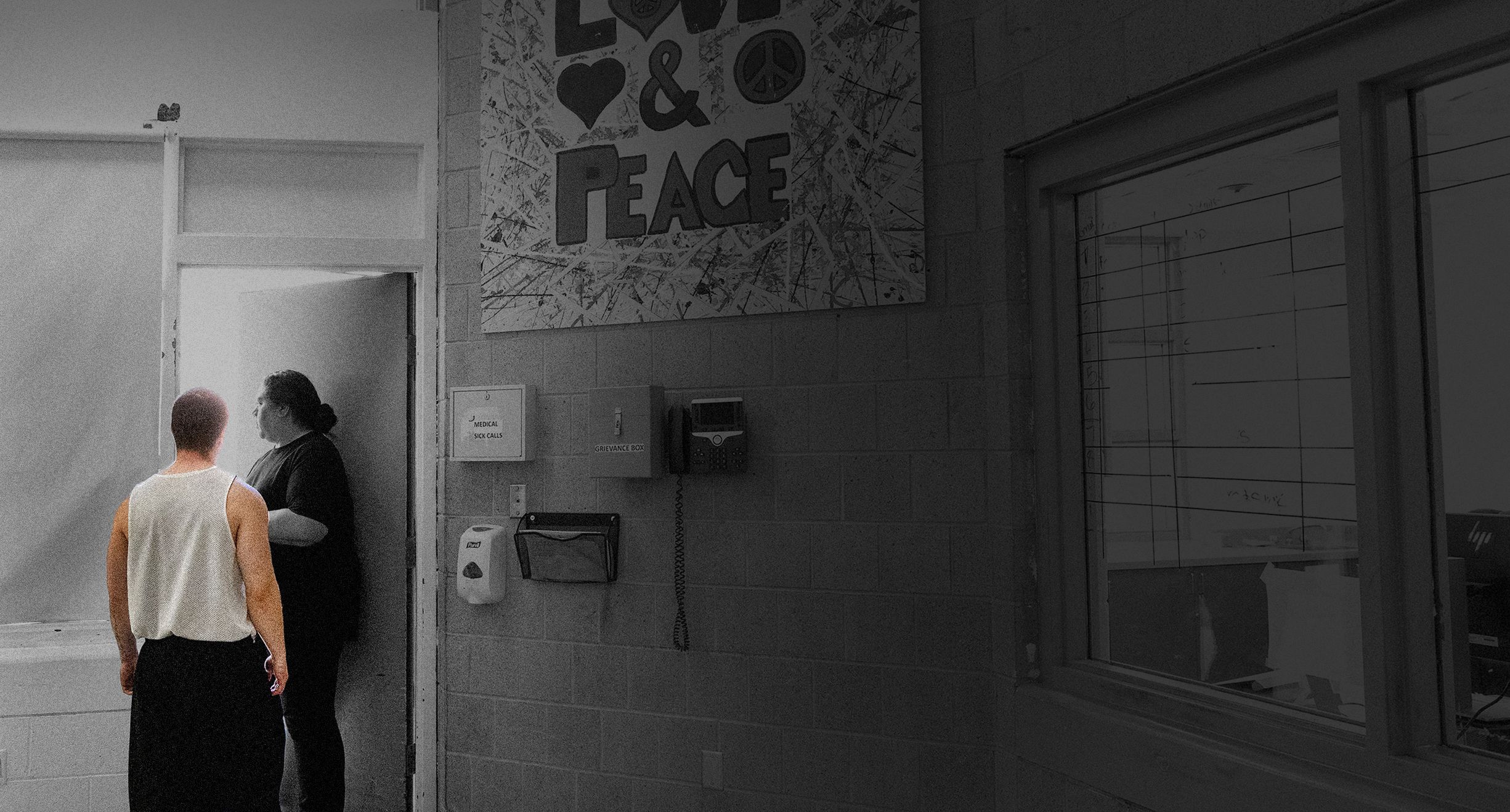 A youth walks out the door alongside unit supervisor [NAME] in the community room at Decker Lake Youth Center.
