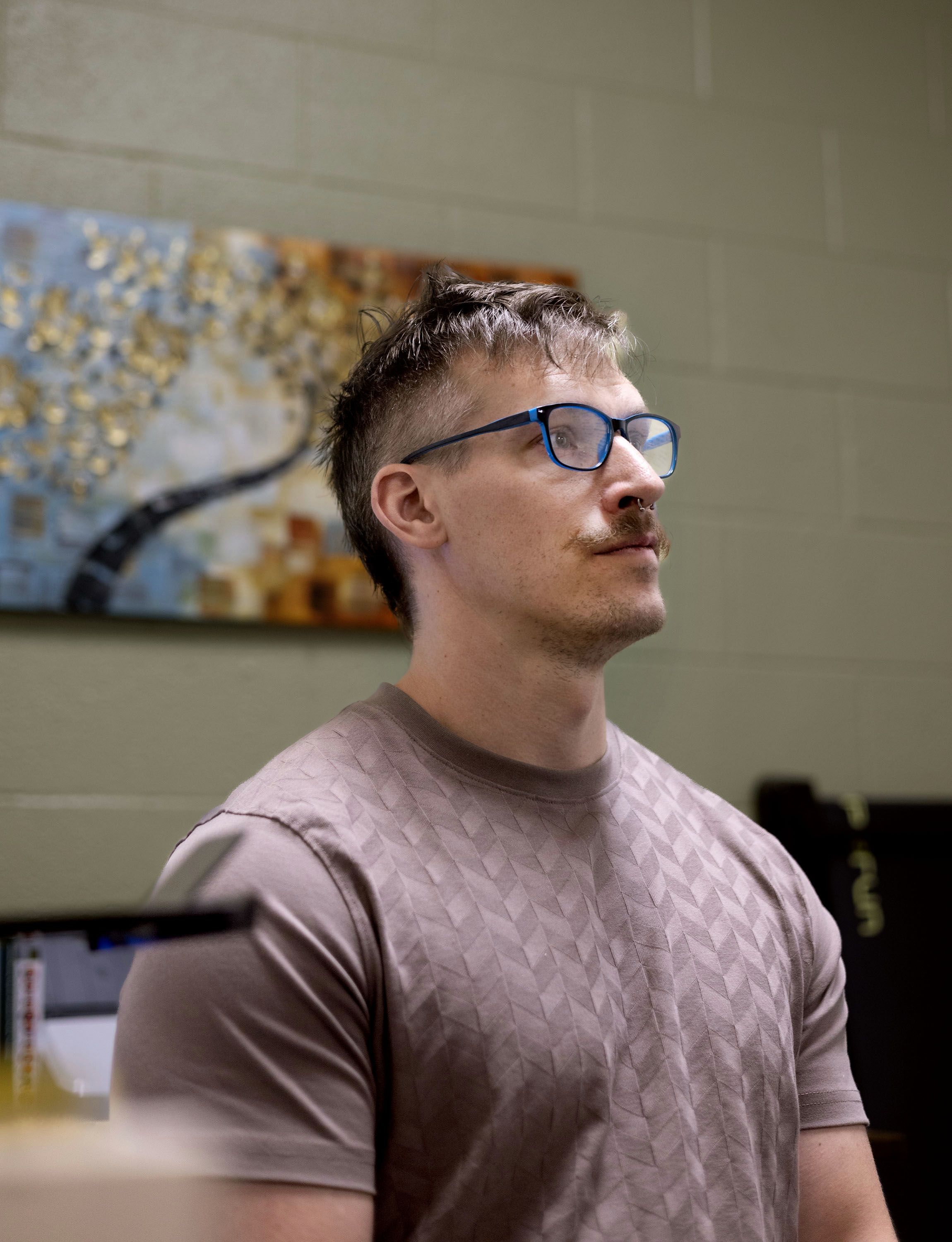 Daniel Wixom, ADN, RN, CCHP, inside the nurses' office at Salt Lake Valley Youth Center.