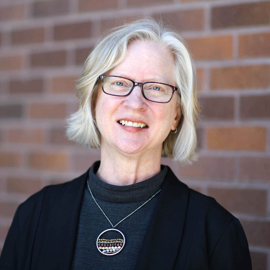 Image of Dr. Gwen Latendresse, a woman with shoulder-length gray hair and glasses wearing a cardigan.