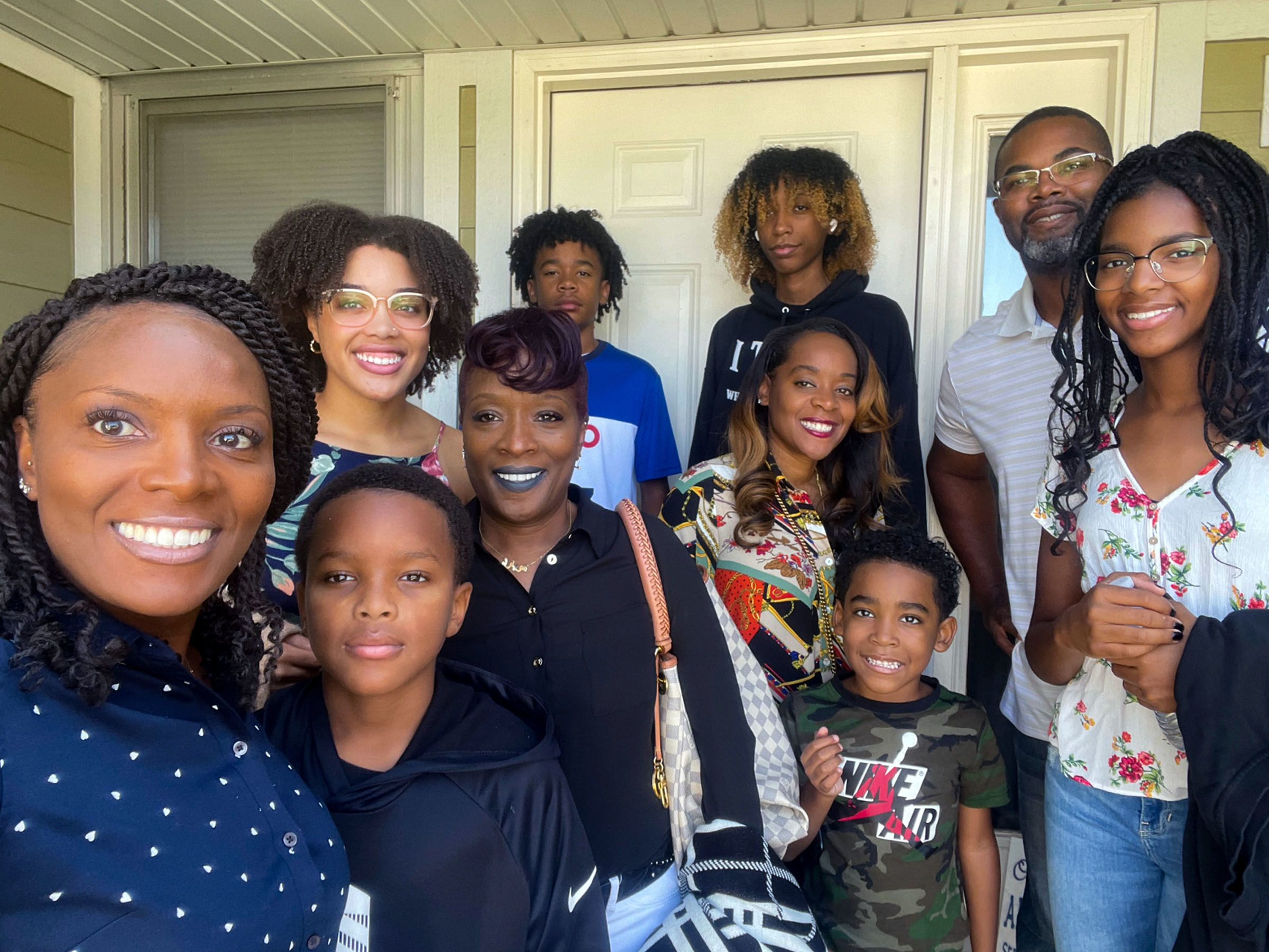 Nakia takes a family selfie on the front porch as they head out for church.