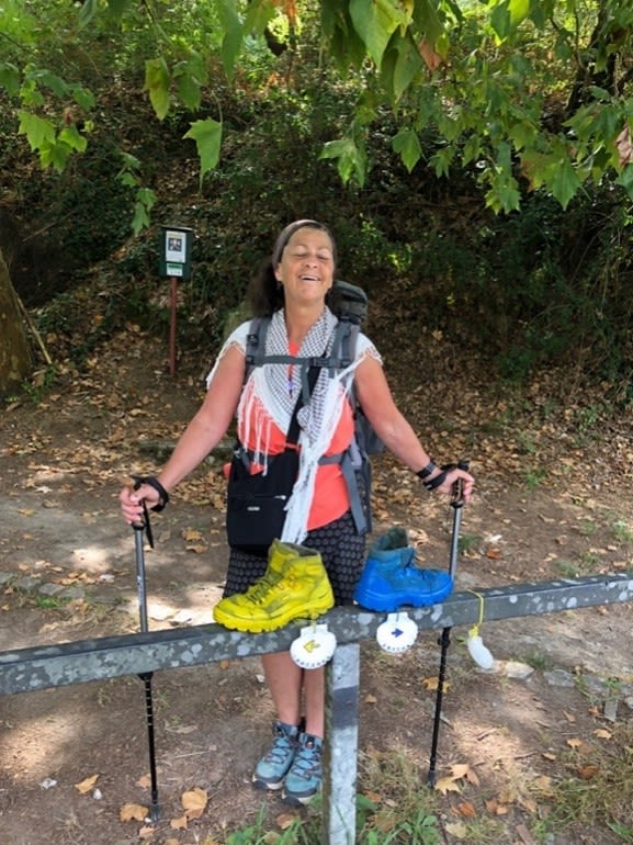 Photo of Suzy Mang embracing a personal goal to complete the El Camino trail.