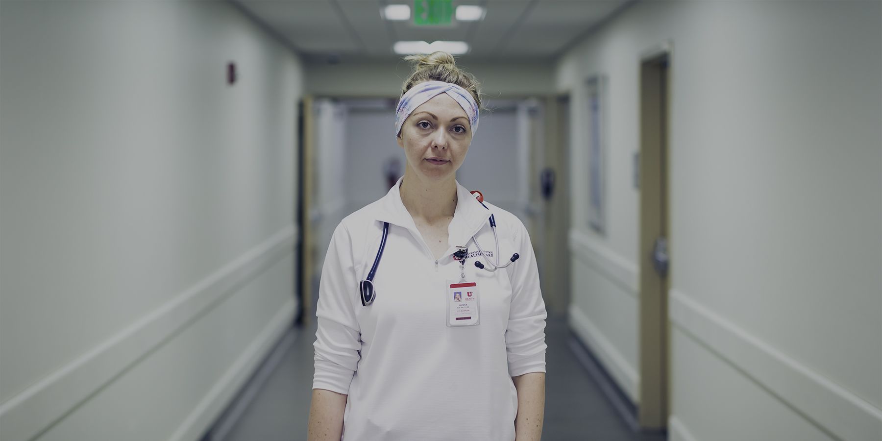 Registered nurse Alisha Barker stands in the halls of University Hospital.